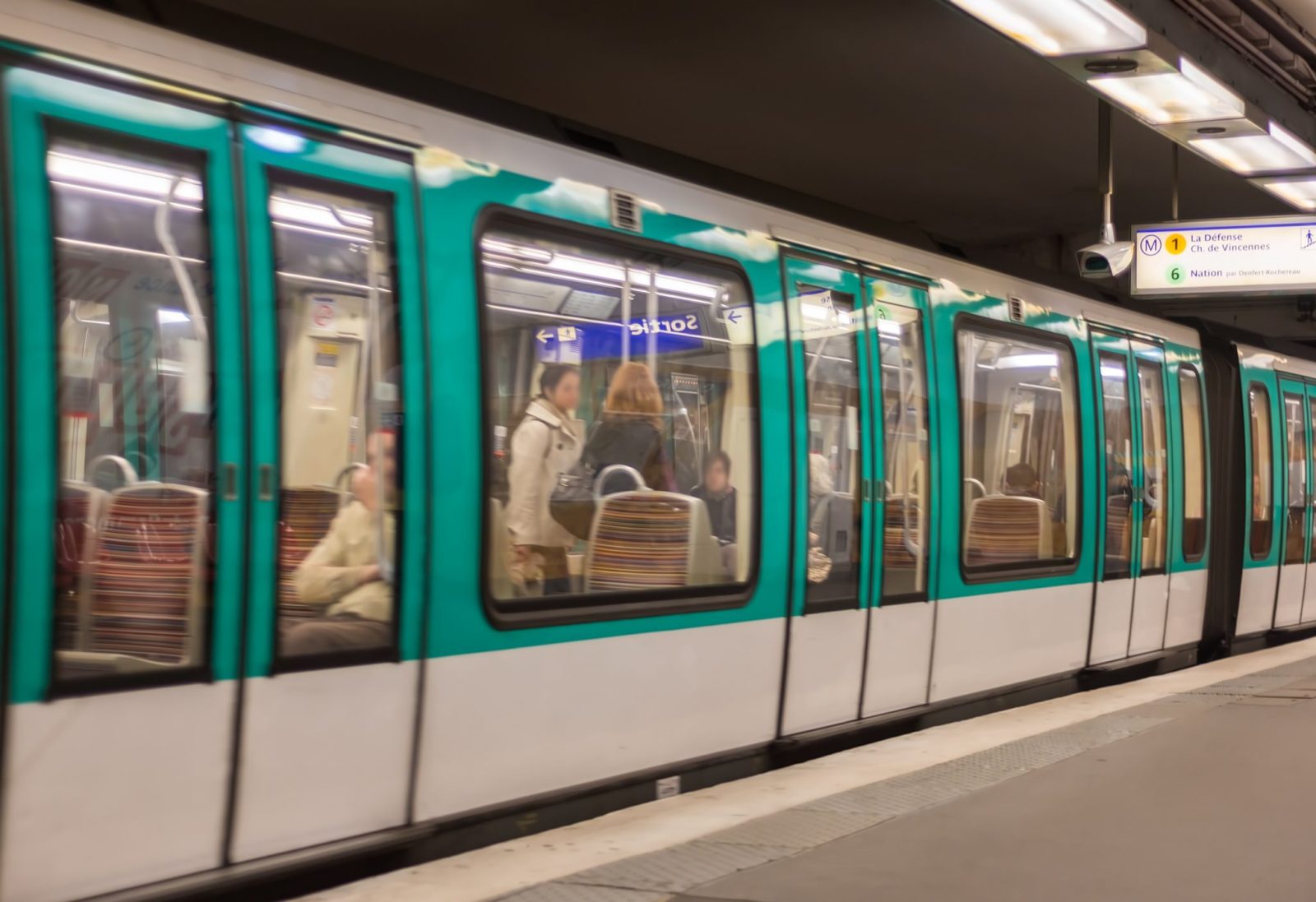 Metro train in a Paris station, France.